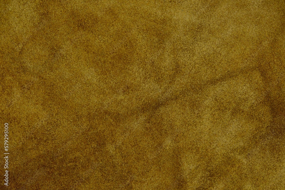 Brown suede cut as background textured and wallpaper. Rustic style leather
