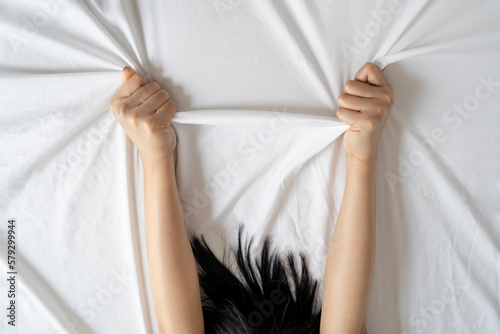 Obraz na plátně Woman having orgasm with boyfriend on white bed