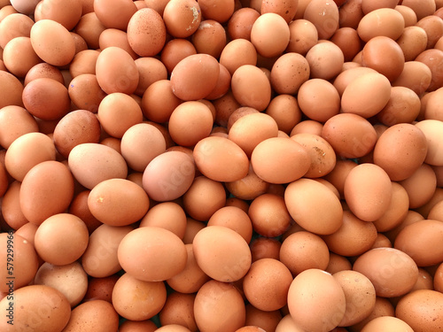 top view raw brown eggs background