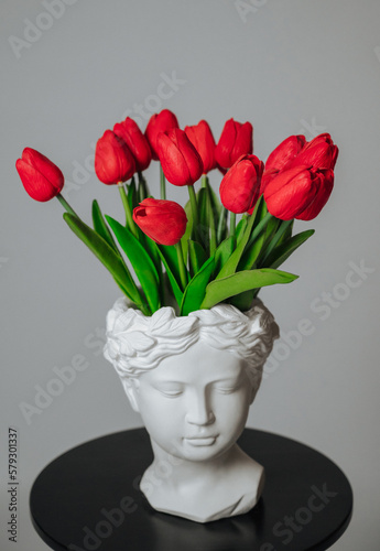a bouquet of red tulips on a white background