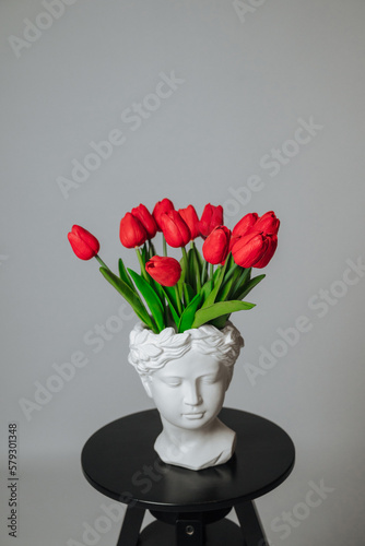 a bouquet of red tulips on a white background