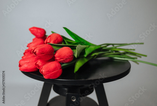 a bouquet of red tulips on a white background