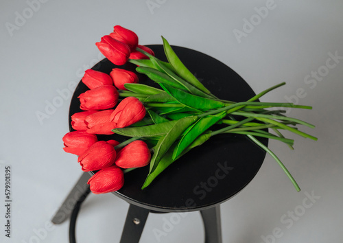 a bouquet of red tulips on a white background