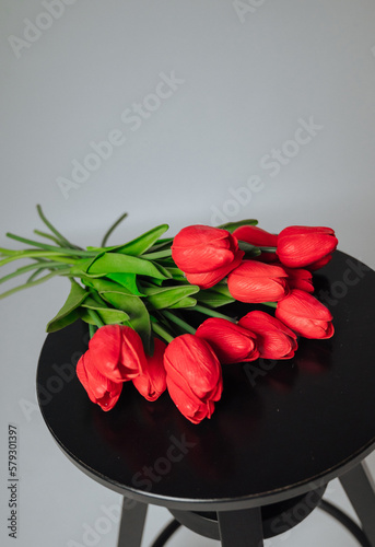 a bouquet of red tulips on a white background
