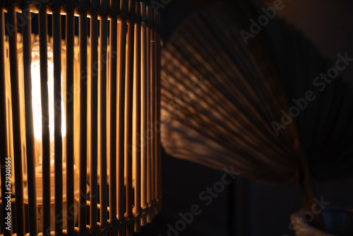 a wooden lamp shines on the table