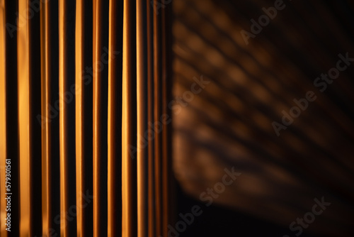 a wooden lamp shines on the table