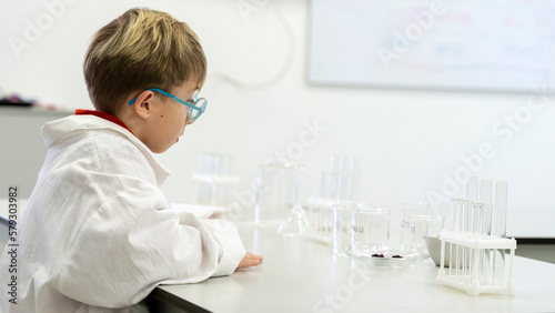 a student in a chemical laboratory conducts chemical experiments