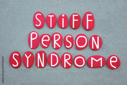 Stiff person syndrome, sps, rare, progressive neurological disorde text composed with red colored stone letters overr green sand photo