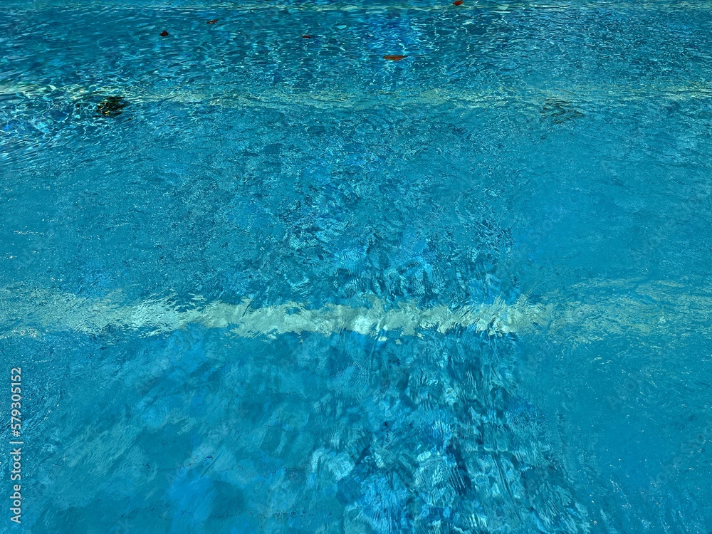 Naklejka premium Top view of ripped water in a outdoor swimming pool with texture and reflection.