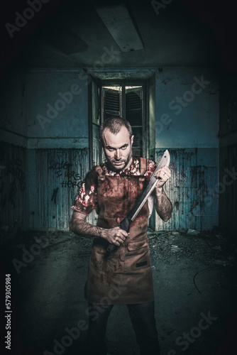 Obraz na plátně serial killer with machete and blood stained apron