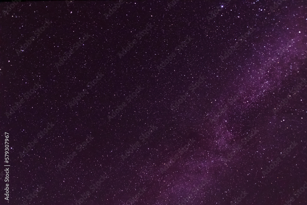 Milky Way galaxy in dark purple night sky Milky Way galaxy in dark purple night sky