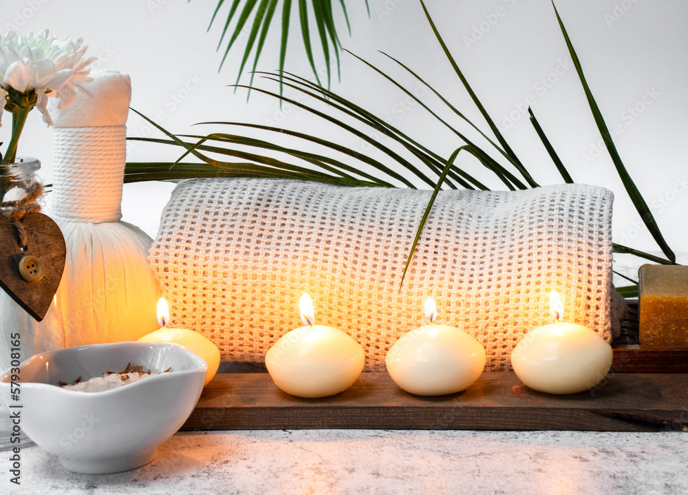 Spa concept with a towel candles salt is for relaxation Spa concept with a towel candles salt is for relaxation