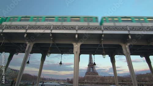 Paris metro underground subway system train passing on bridge Bir Hakeim railroad in Paris, France photo