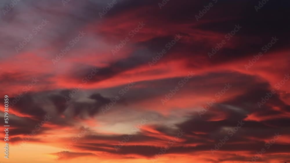 Bloody dawn. Red clouds with the rising sun. The sun turns the clouds red with an ominous light. Hell's sky.