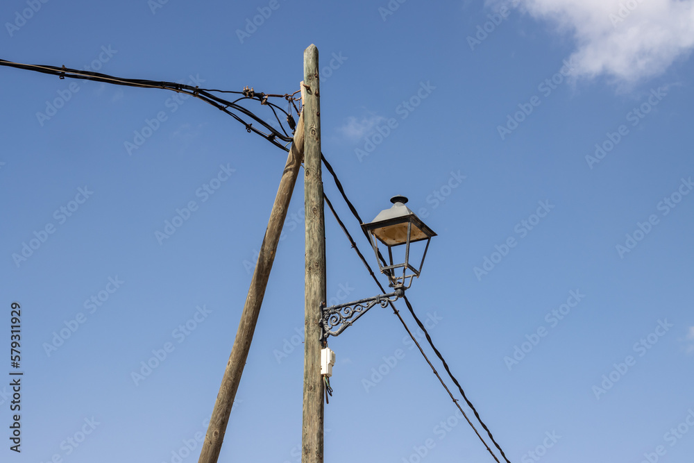 Old style lantern on a wooden pole, Spain Old style lantern on a wooden pole, Spain