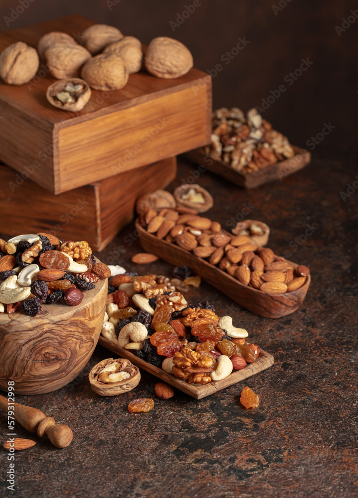 Mix of nuts and raisins on a brown rustic background. Mix of nuts and raisins on a brown rustic background.