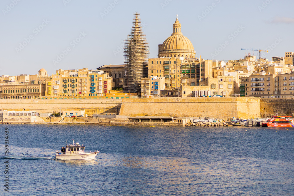 The view on Valletta with a small boat seeing from Manoel Island, Malta, Europe