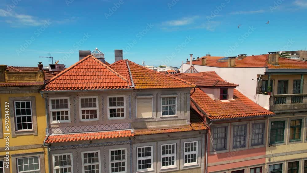 Aerial view of houses with red roofs in the old town in Porto city center at sunny day Aerial view of houses with red roofs in the old town in Porto city center at sunny day
