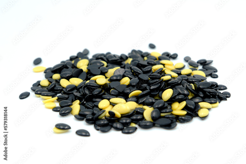 Depilatory Pearl Hard Wax Beans, black and white color. Waxing granules isolated on white background