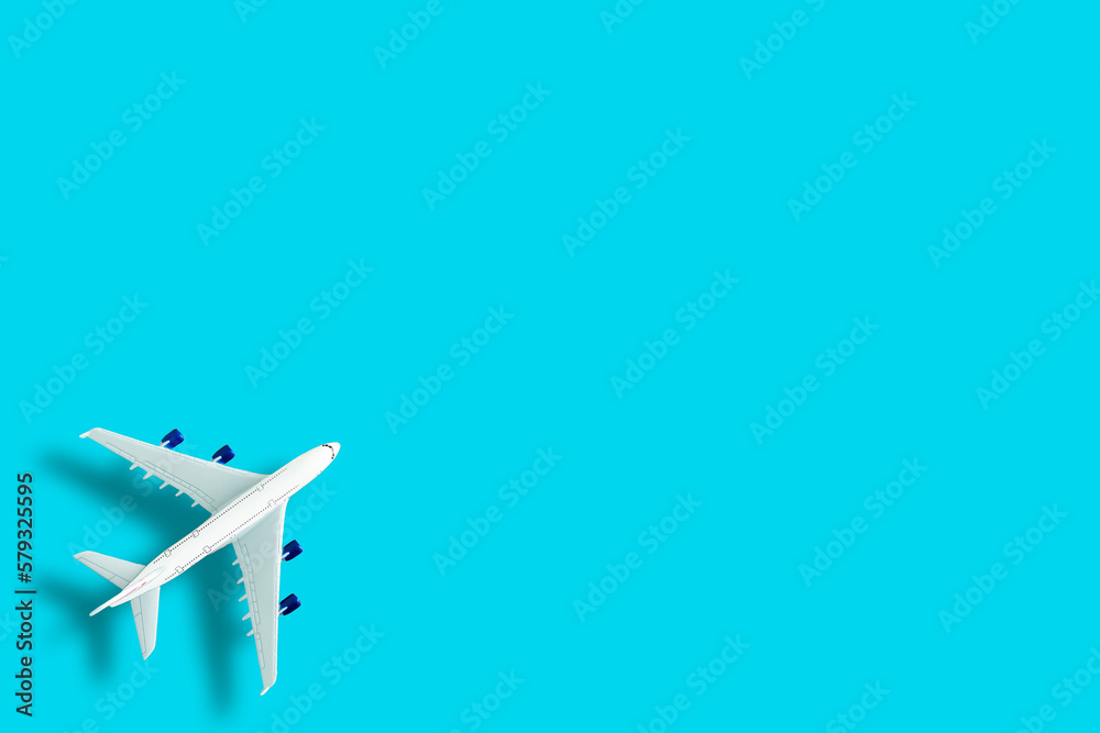 Model plane, airplane on blue pastel color background.
