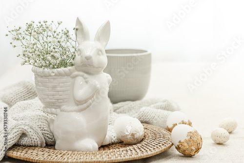 Easter composition with a ceramic hare and eggs. photo