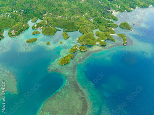 Fototapeta Naklejka Na Ścianę i Meble -  Aerial view of tropical islands in a blue lagoon with turquoise water. Sipalay, Negros, Philippines.