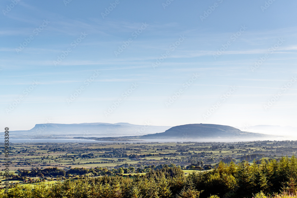 N.E. to Knocknarea Mt. beyond Ballysadare Bay, Sligo, Ireland. Early morning. Prehistoric stone cairn known as Queen Maeves Grave visible on summit