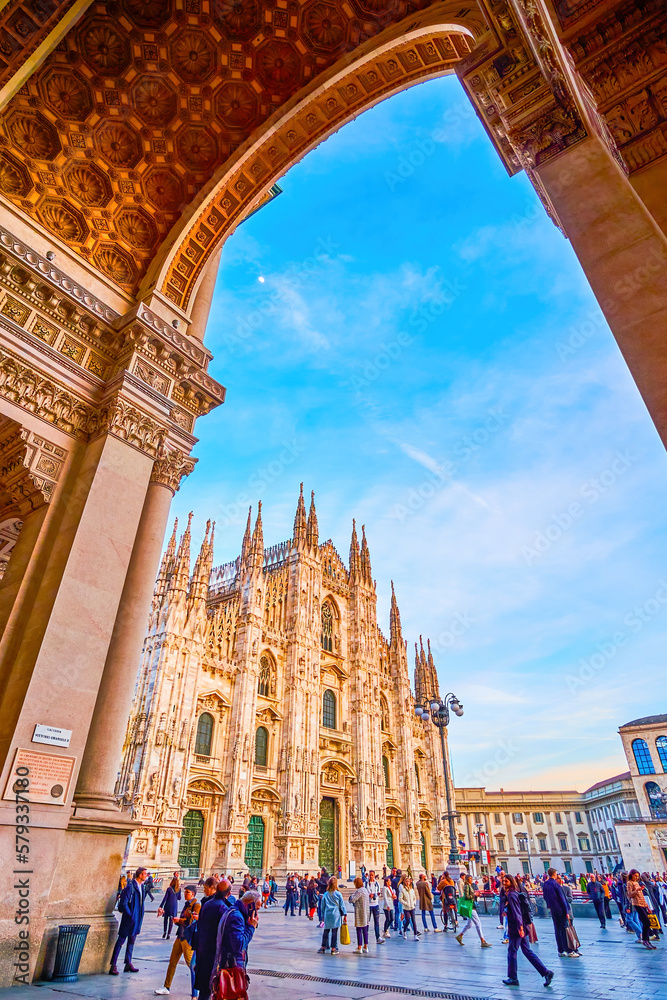 The view on Duomo di Milano throught the main entrance portal of Galleria Vittorio Emanuele II, Milan, Italy