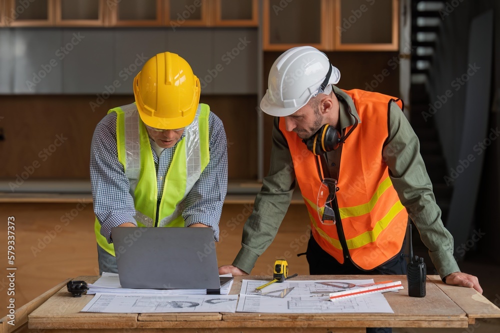 engineer team planning and discussing about construction building on table in working site engineer team planning and discussing about construction building on table in working site