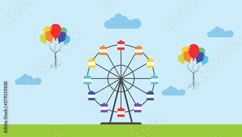 amusement park with ferris wheel. carousel in summer with green grass, clouds and balloons
