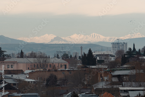 panorama of the city with snow mountains  © Konstantin