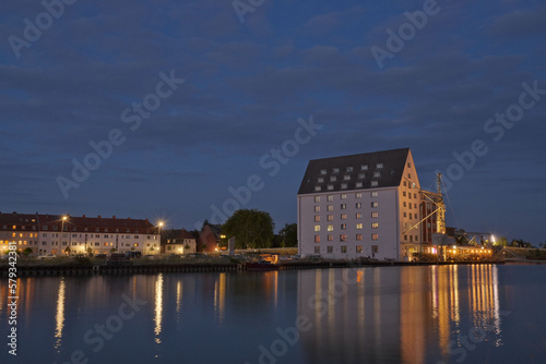 House illuminated at sunset in the harbor of Munster, Germany