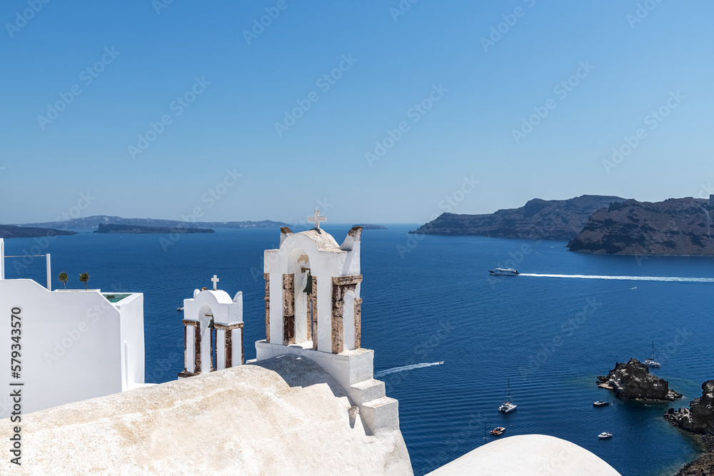 Fototapeta premium White bell towers on the island of Santorini. Greece