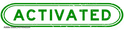 Grunge green activated word rubber seal stamp on white background