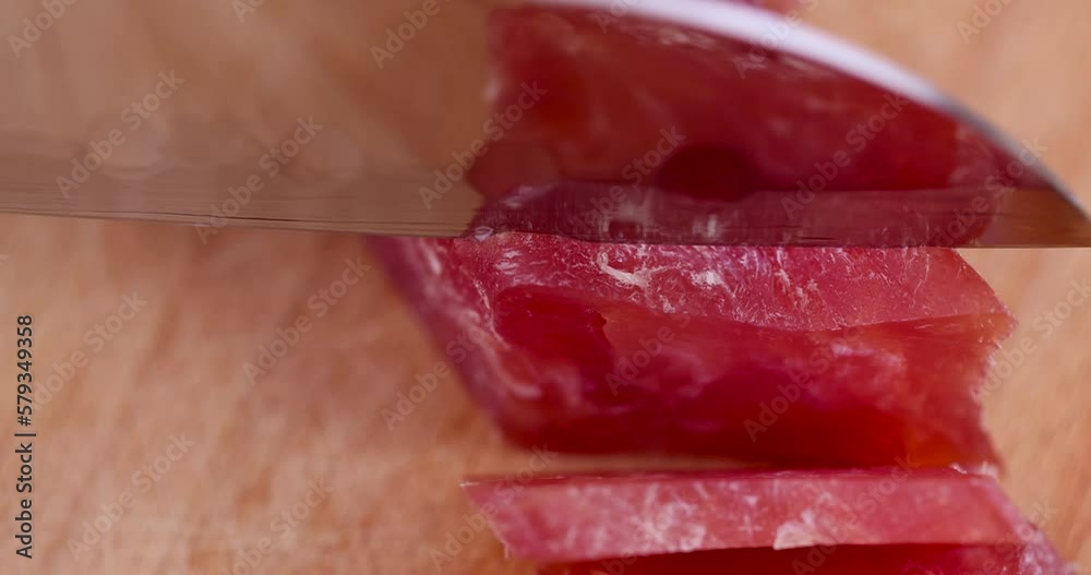 Sliced square sausage from chicken fillet, cured sausage made from high-quality chicken broiler fillet Sliced square sausage from chicken fillet, cured sausage made from high-quality chicken broiler fillet