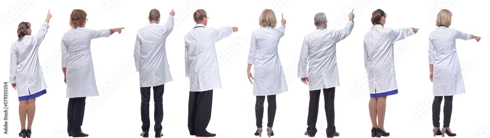 group of doctors standing with their backs isolated group of doctors standing with their backs isolated