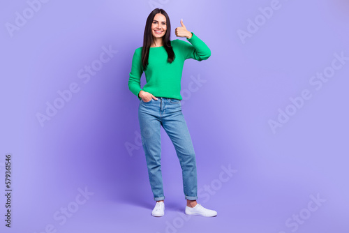 Full body photo of promoter lady model showing thumb up gesture good mood isolated purple color background