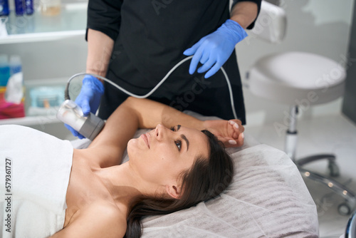 Medic doing course of anti-aging procedures for female