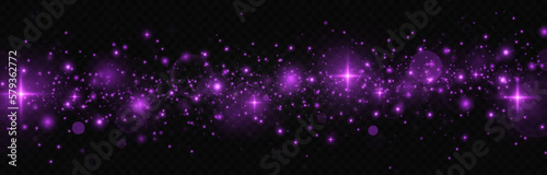 The dust sparks and purple stars shine with special light. Christmas abstract stylish light effect. Purple dust, purple sparks and purple stars.