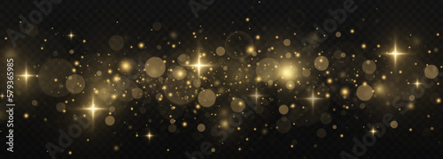 Glowing dust particles effect. The dust sparks and golden stars shine with special light on a transparent background. Christmas concept. Golden luminous dust.