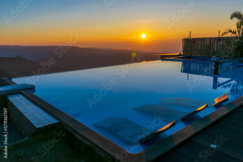 A view of sunrise against an infinity pool, Cherrapunji, Meghalaya, India