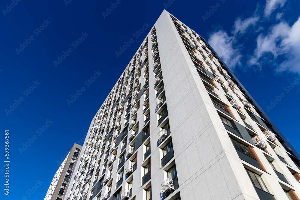 The facade of the new residential high-rise buildings against the sky 