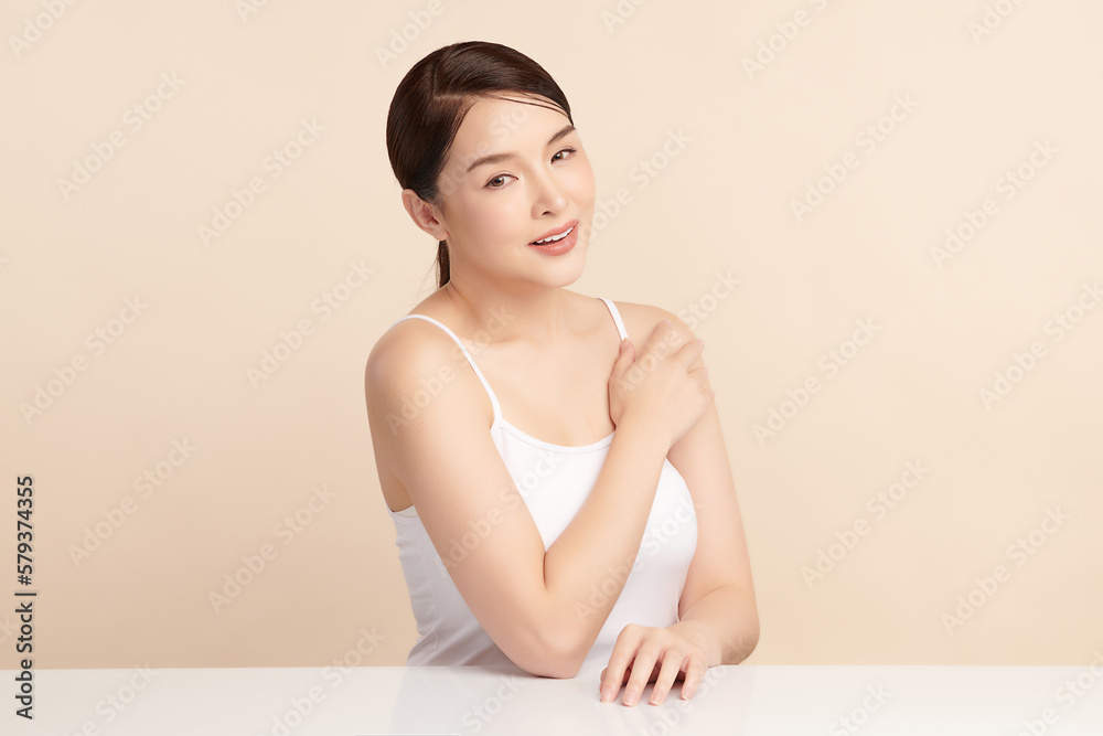 Beautiful young asian woman with clean fresh skin on beige background, Face care, Facial treatment, Cosmetology, beauty and spa, Asian women portrait. Beautiful young asian woman with clean fresh skin on beige background, Face care, Facial treatment, Cosmetology, beauty and spa, Asian women portrait.