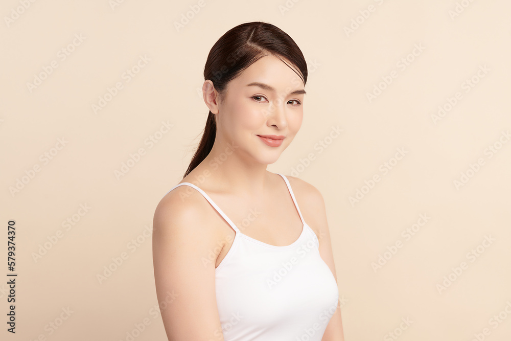 Beautiful young asian woman with clean fresh skin on beige background, Face care, Facial treatment, Cosmetology, beauty and spa, Asian women portrait. Beautiful young asian woman with clean fresh skin on beige background, Face care, Facial treatment, Cosmetology, beauty and spa, Asian women portrait.