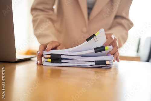 Business Documents  Auditor businesswoman checking searching document legal prepare paperwork or report for analysis TAX time accountant Documents data contract partner deal in workplace