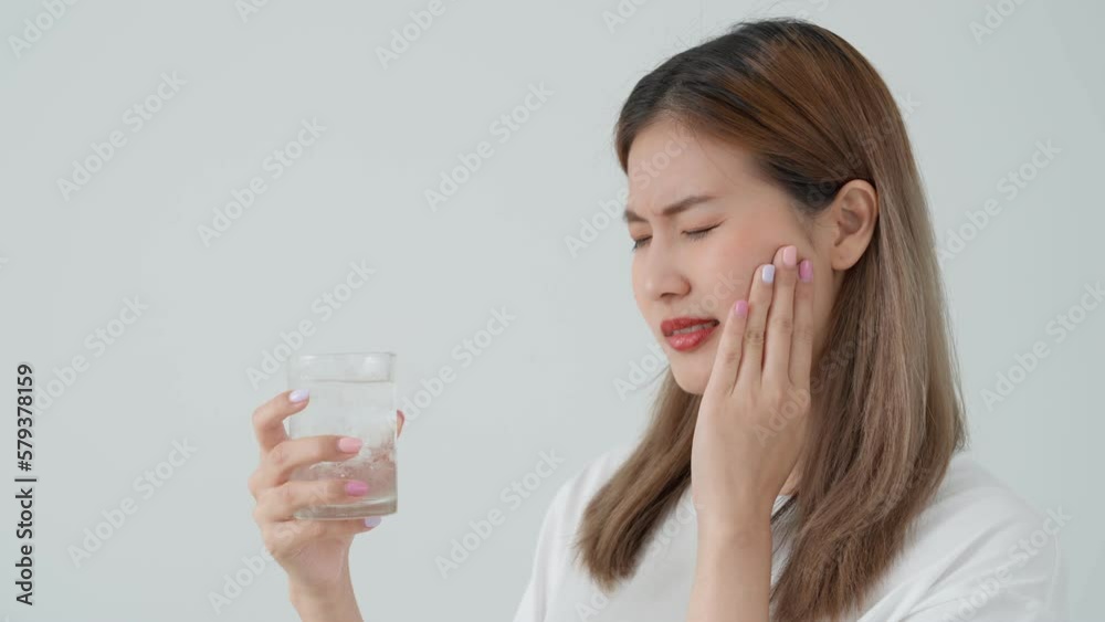 Asian woman feel sensitive teeth after drinking cold, female suffer tooth, decay problems, dental care, tooth extraction, decay problem, bad breath, Gingival Recession, Oral Hygiene instruction Asian woman feel sensitive teeth after drinking cold, female suffer tooth, decay problems, dental care, tooth extraction, decay problem, bad breath, Gingival Recession, Oral Hygiene instruction