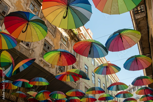 Colorful rainbow umbrellas on Pink Street in Lisbon, Portugal, Europe
