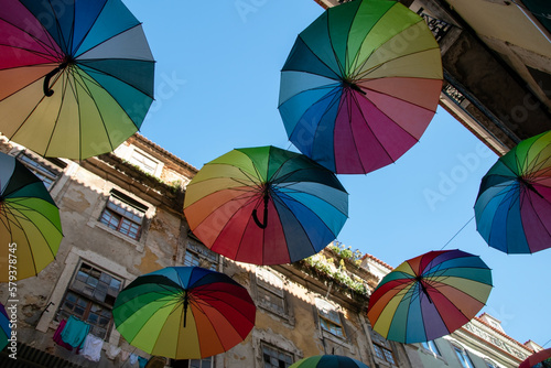 Colorful rainbow umbrellas on Pink Street in Lisbon, Portugal, Europe
