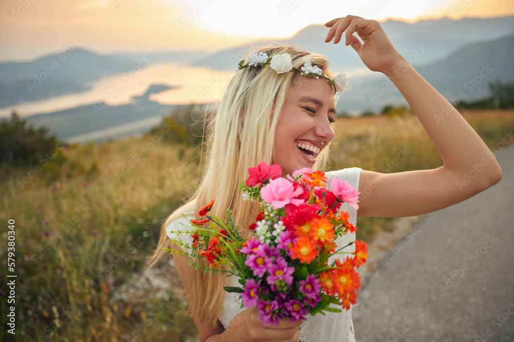 Boho style bride with bouquet feeling carefree and full of joy. Nature, outside, wedding, bohemian style, traveling concept. Boho style bride with bouquet feeling carefree and full of joy. Nature, outside, wedding, bohemian style, traveling concept.