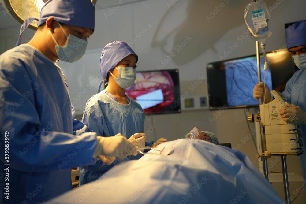 Medical Team Performing Surgical Operation in Modern Operating Room. inside operation room Medical Team Performing Surgical Operation in Modern Operating Room. inside operation room